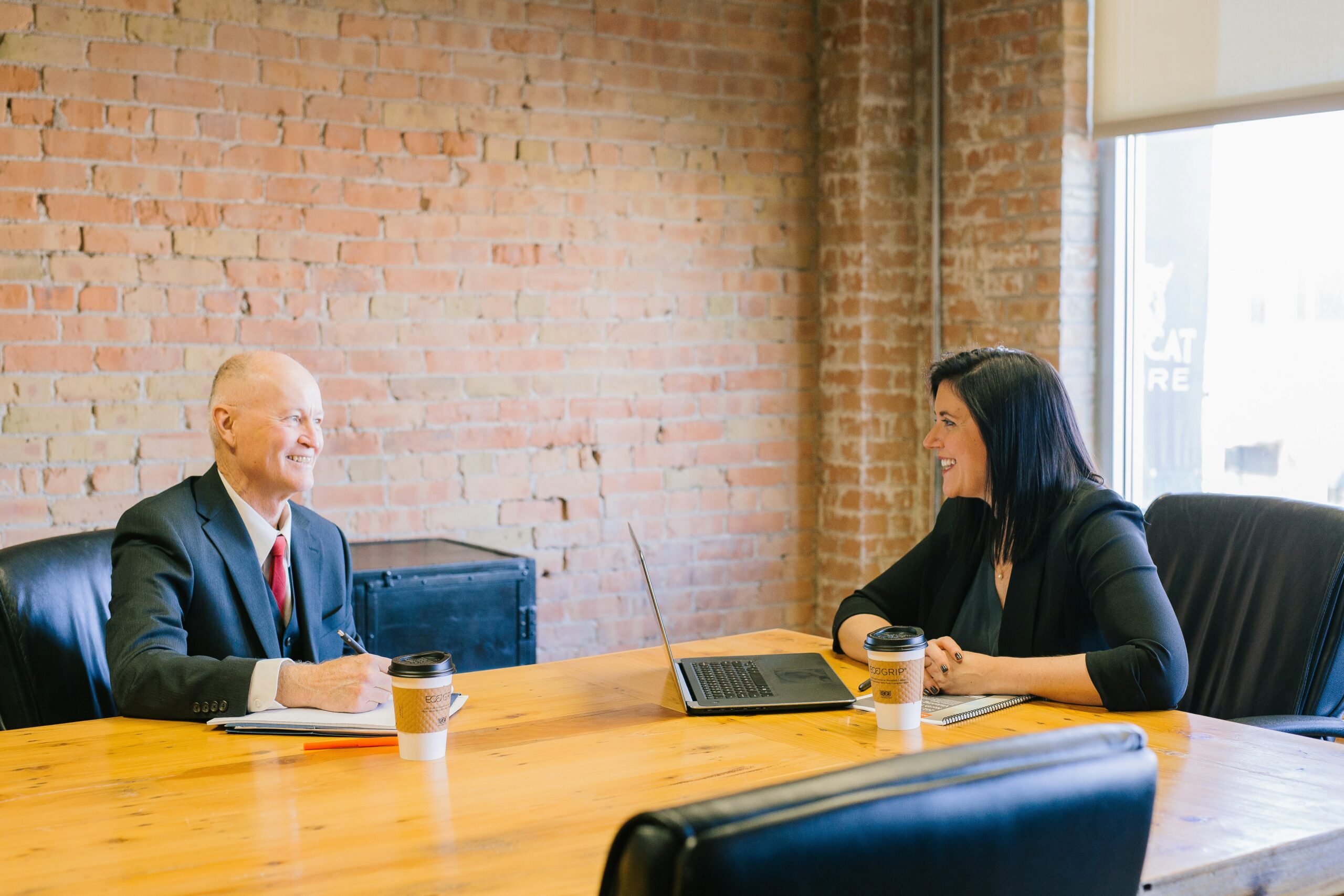 Travel Spark founder working with a client